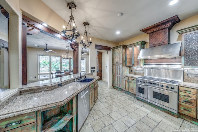 kitchen with ceiling fan, backsplash, sink, hanging light fixtures, and stainless steel appliances