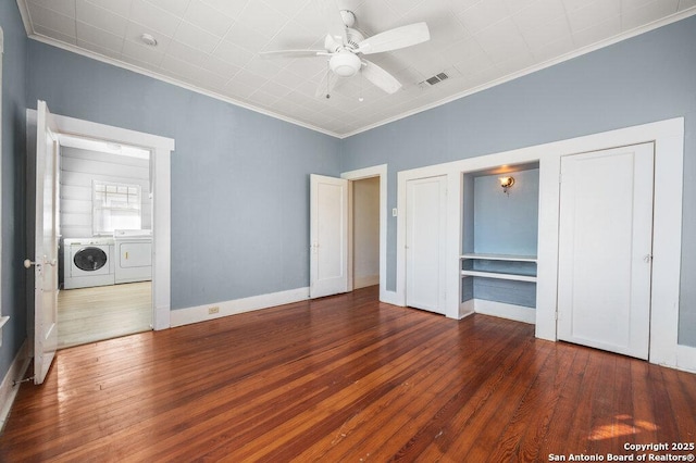 unfurnished bedroom with separate washer and dryer, crown molding, dark hardwood / wood-style floors, and ceiling fan