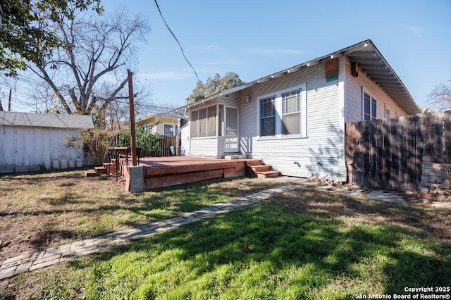 exterior space featuring a yard and a deck