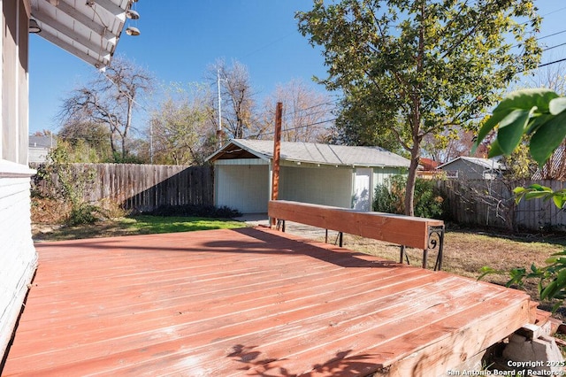 wooden terrace with an outbuilding