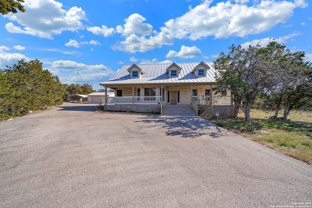 view of front of home with a garage and covered porch