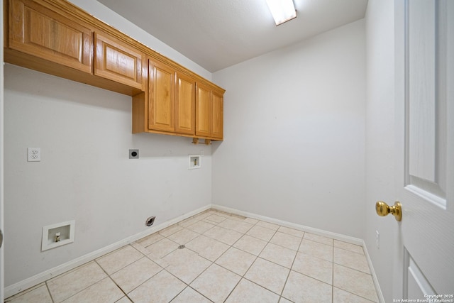 clothes washing area with cabinets, hookup for a washing machine, and hookup for an electric dryer