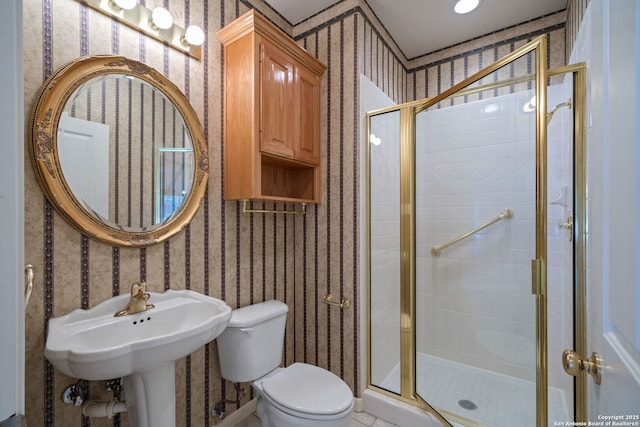 bathroom featuring toilet and walk in shower