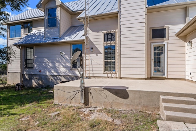 back of property featuring a patio