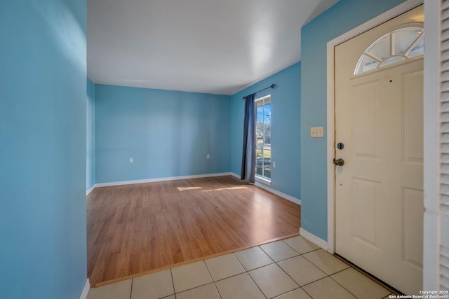 entryway with light tile patterned floors