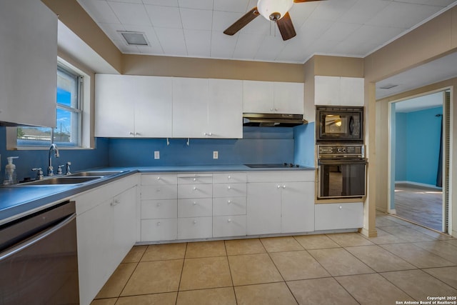 kitchen featuring light tile patterned floors, ceiling fan, black appliances, white cabinets, and sink