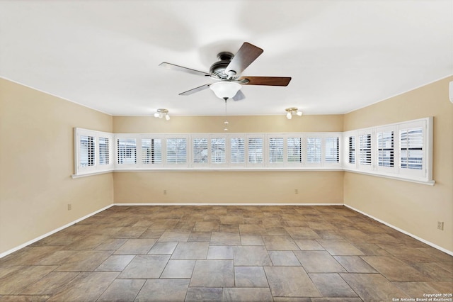 unfurnished room with ceiling fan