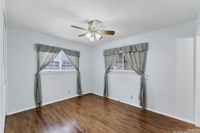 unfurnished room with ceiling fan and dark hardwood / wood-style floors