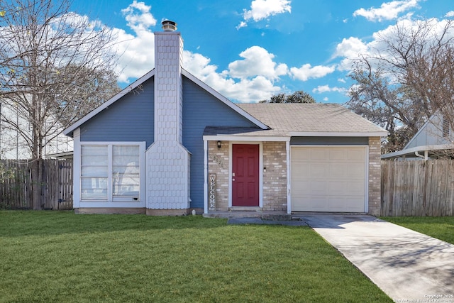 view of front of house featuring a garage and a front yard