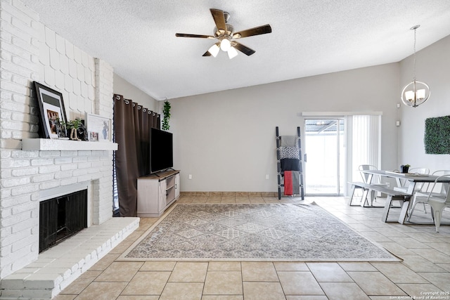 unfurnished living room featuring a fireplace, light tile patterned flooring, a textured ceiling, and vaulted ceiling