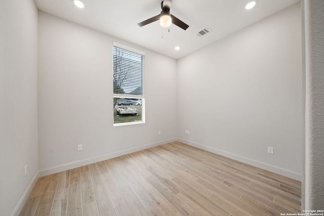 spare room with ceiling fan and light hardwood / wood-style flooring