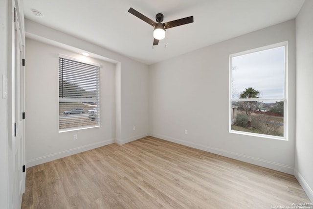 spare room featuring ceiling fan and light hardwood / wood-style flooring