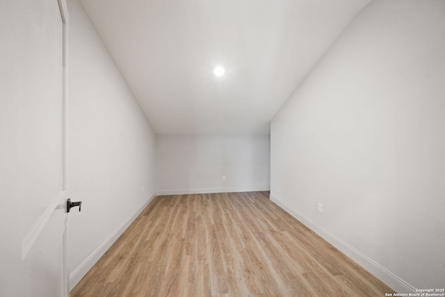 bonus room with light hardwood / wood-style flooring