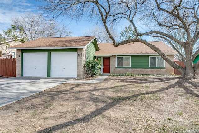 ranch-style home featuring a garage