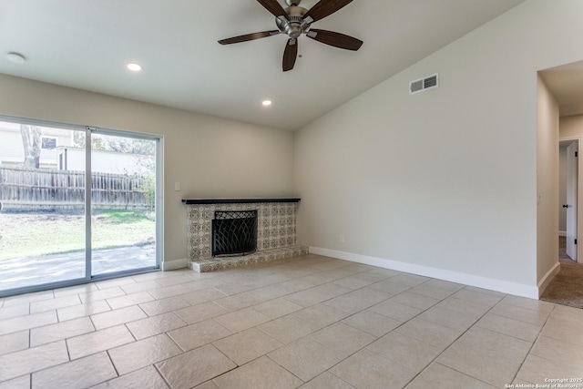 unfurnished living room with ceiling fan, light tile patterned floors, and vaulted ceiling