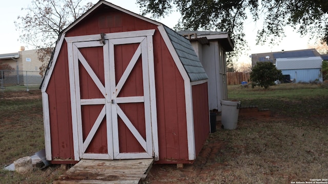 view of outdoor structure with a lawn