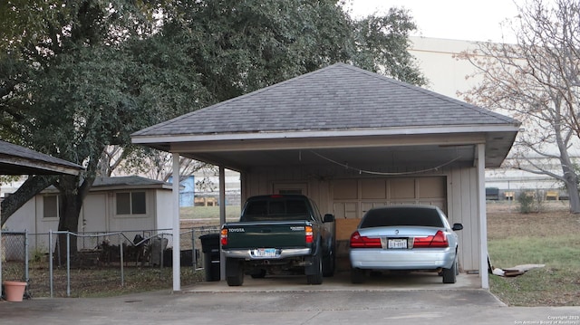 view of parking / parking lot featuring a carport