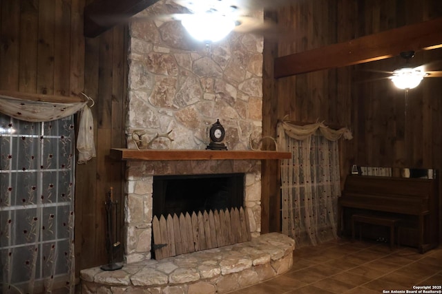 tiled living room featuring wood walls