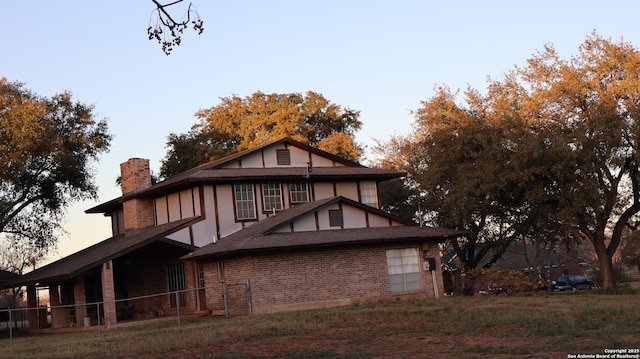 view of back house at dusk