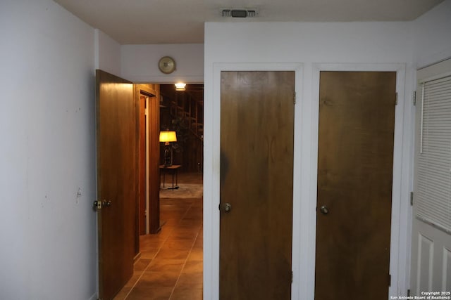 corridor featuring tile patterned floors