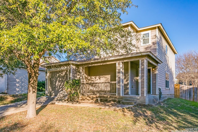 view of front facade featuring a front lawn and covered porch