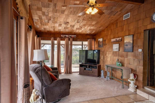 living room featuring lofted ceiling, light colored carpet, ceiling fan, wood walls, and wood ceiling