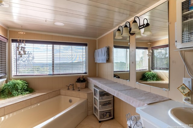 bathroom with wood ceiling, a tub to relax in, tile patterned flooring, ornamental molding, and vanity