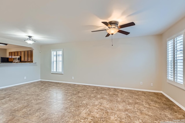 spare room featuring ceiling fan