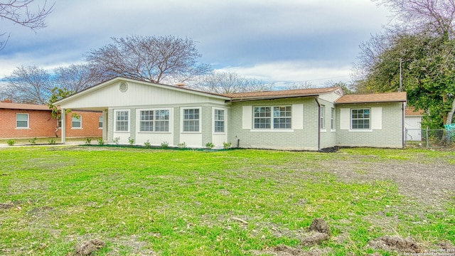 rear view of house with a lawn