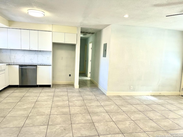 kitchen featuring light tile patterned floors, white cabinetry, ceiling fan, decorative backsplash, and dishwasher