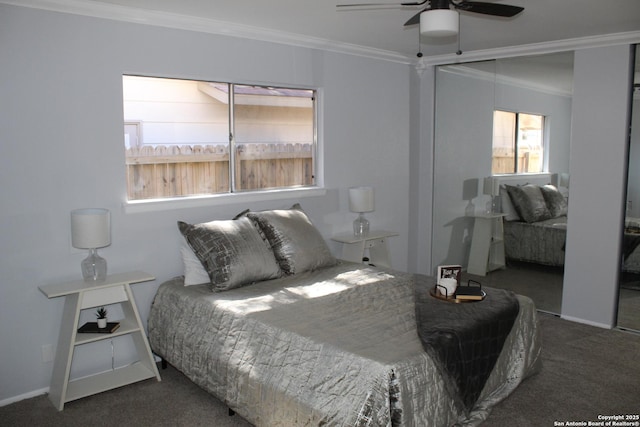 carpeted bedroom with ceiling fan and ornamental molding