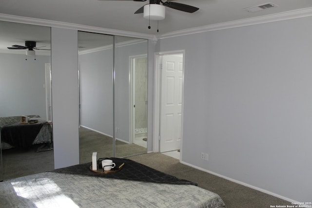 carpeted bedroom featuring ceiling fan and crown molding