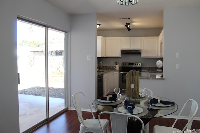 kitchen featuring electric stove, sink, white cabinetry, dark wood-type flooring, and light stone counters