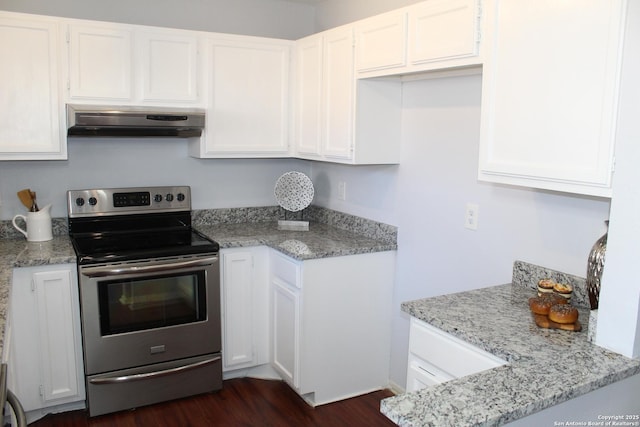 kitchen with light stone countertops, white cabinets, electric range, and dark wood-type flooring