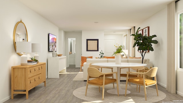 dining area with hardwood / wood-style floors