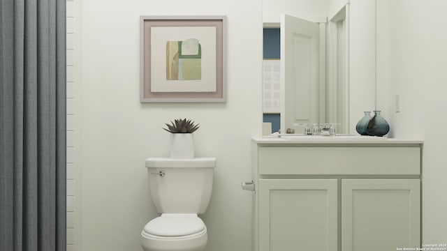 bathroom with toilet and vanity