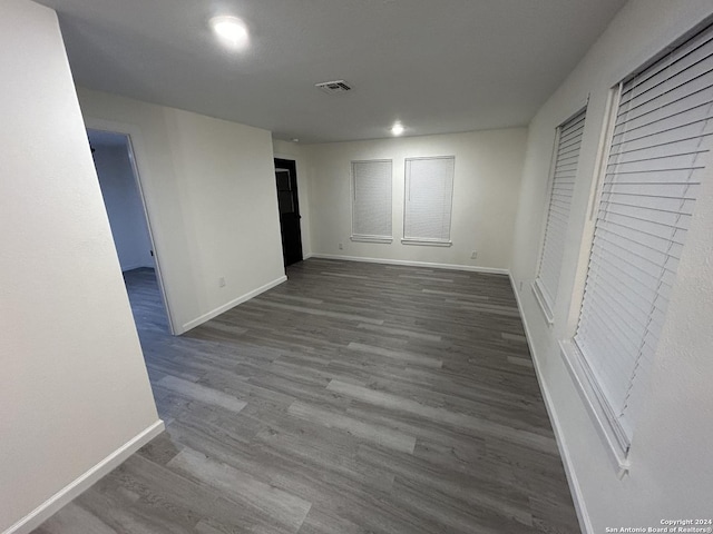 empty room featuring dark wood-type flooring