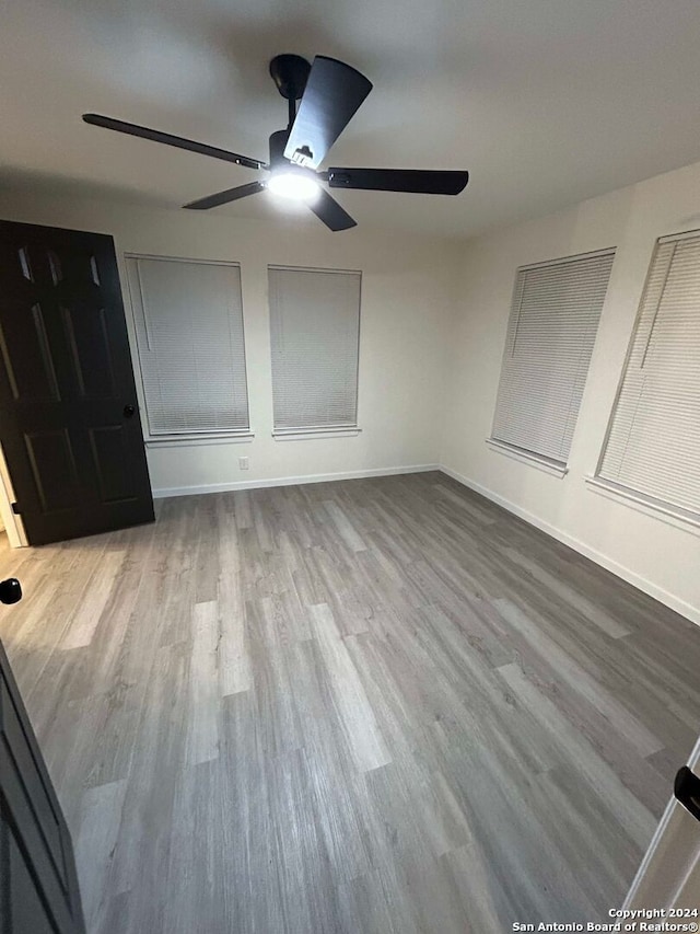 unfurnished bedroom featuring ceiling fan and light hardwood / wood-style floors