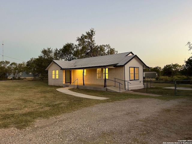 view of front of home with a yard