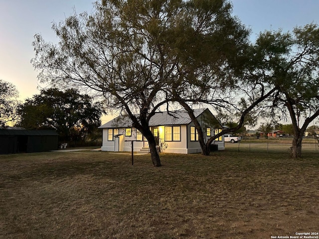 view of front of house with a yard