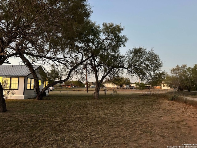 view of yard at dusk