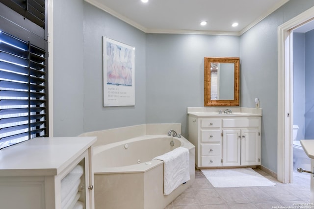 bathroom featuring vanity, ornamental molding, tile patterned floors, a tub, and toilet