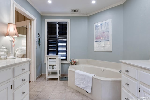 bathroom with ornamental molding, tile patterned flooring, vanity, and a tub