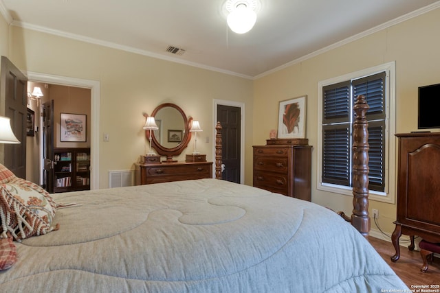 bedroom featuring crown molding and wood-type flooring