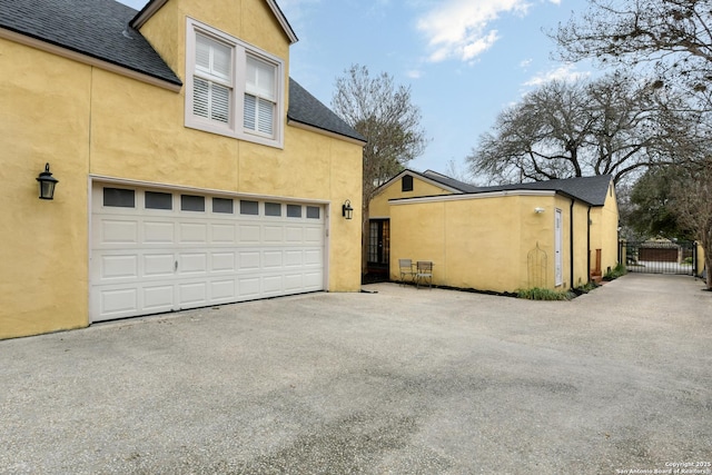 view of side of home with a garage