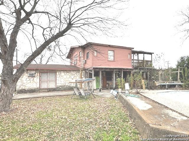 rear view of property featuring a patio