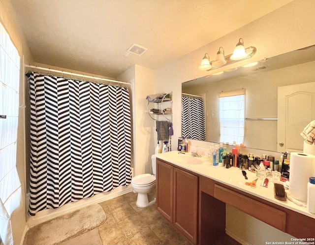 bathroom with tile patterned floors, toilet, and vanity