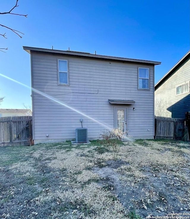 back of property featuring central air condition unit