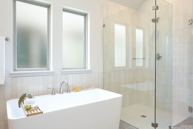 28411 Cohaset Way, San Antonio, TX 78260 - bathroom with a shower stall and tile walls