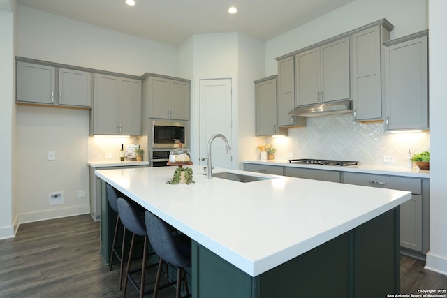 28411 Cohaset Way, San Antonio, TX 78260 - kitchen featuring gray cabinetry, a sink, stainless steel appliances, under cabinet range hood, and recessed lighting
